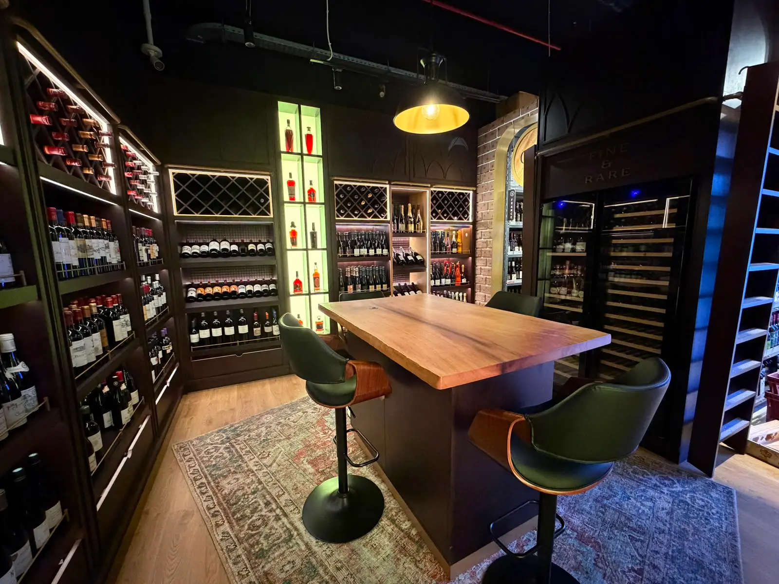 The interior of CRU, brick and walnut with arched cabinet fronts.
